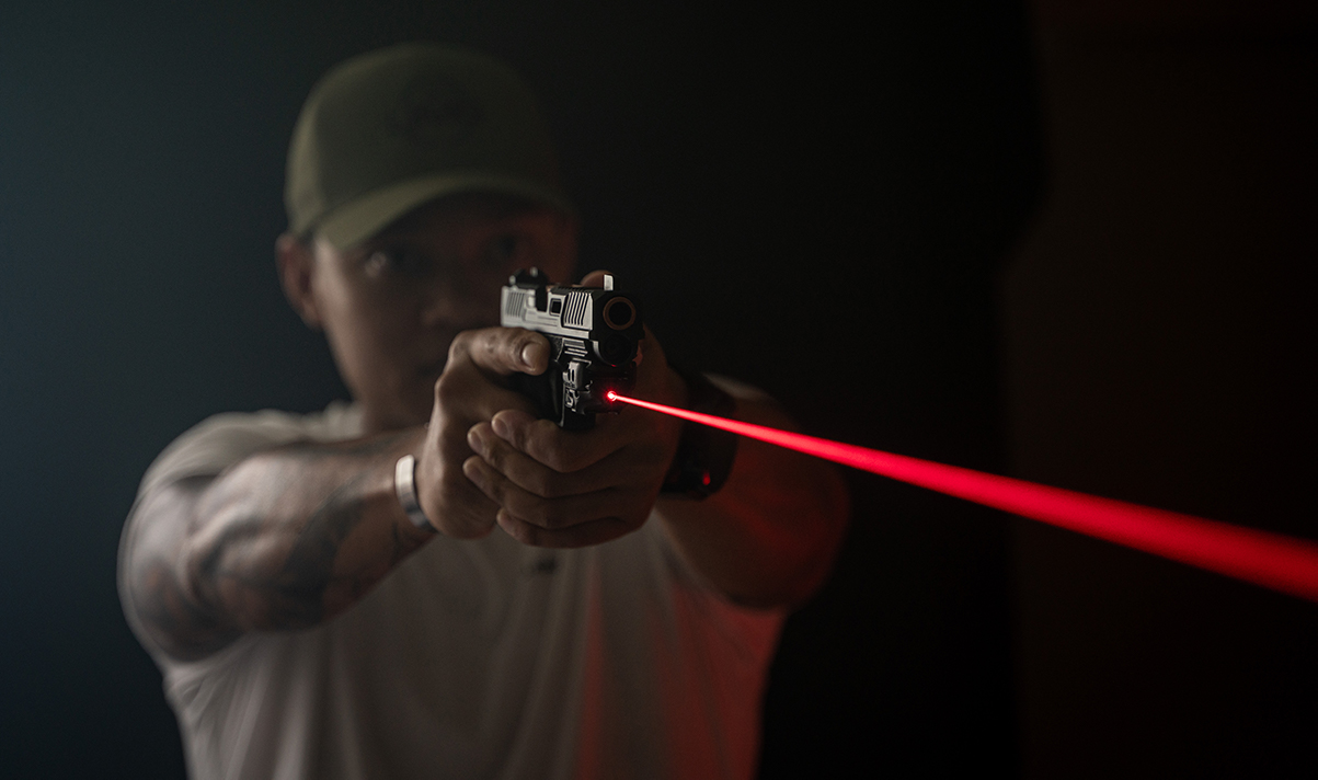 Shooting-with-red-laser-pistol-sight